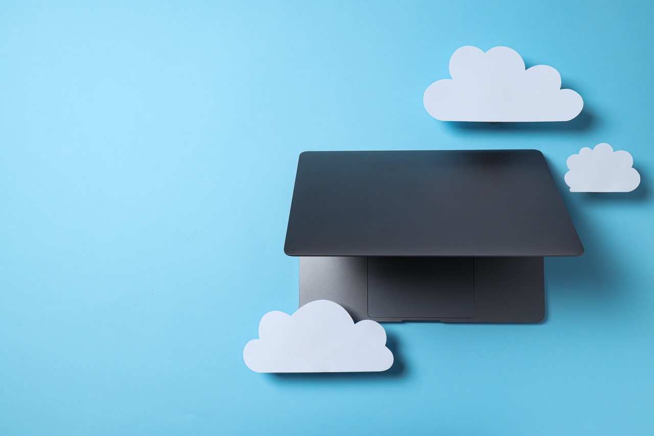 Laptop with cloud-themed visualisation, IT project planning